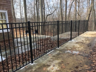 Wrought iron rod fence installation